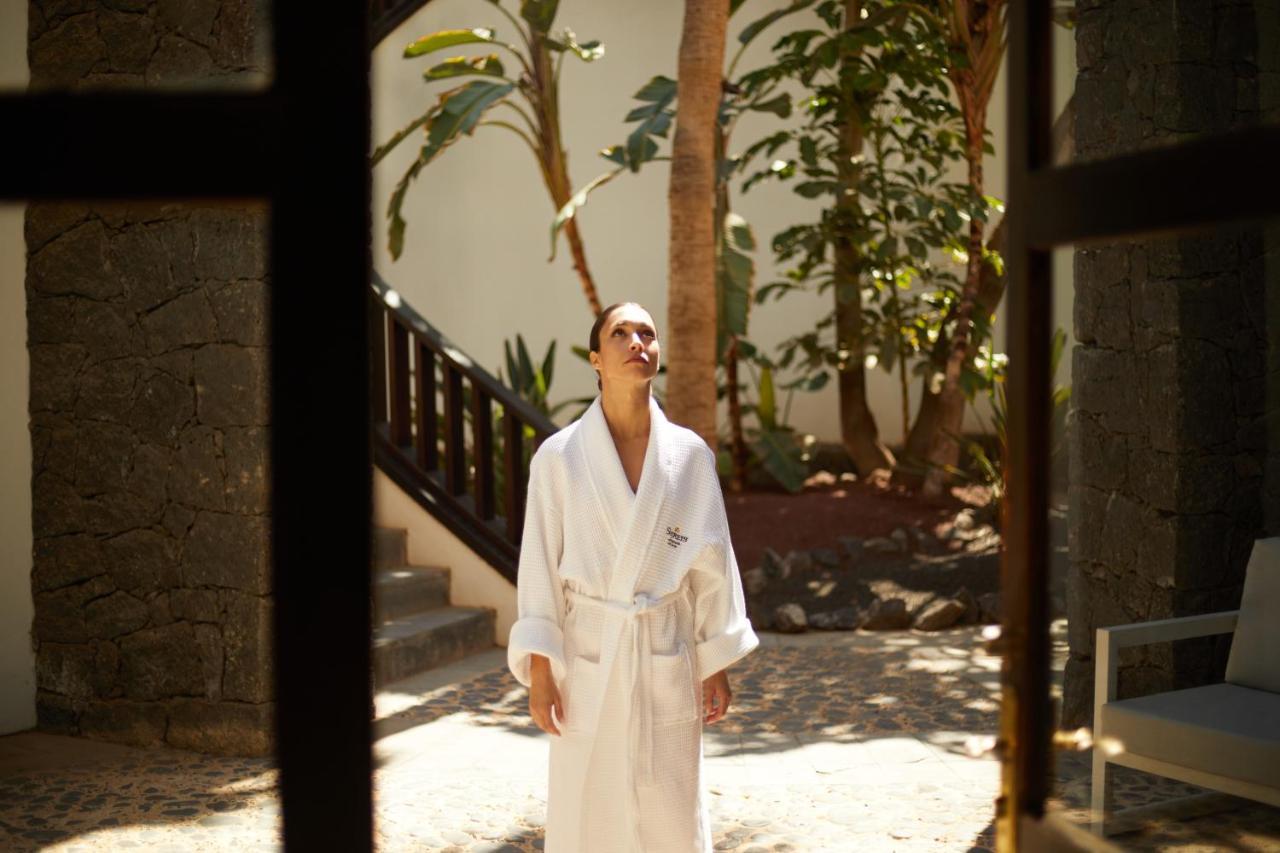 Secrets Lanzarote Resort & Spa - Adults Only Puerto Calero Exteriör bild A woman wearing a bathrobe